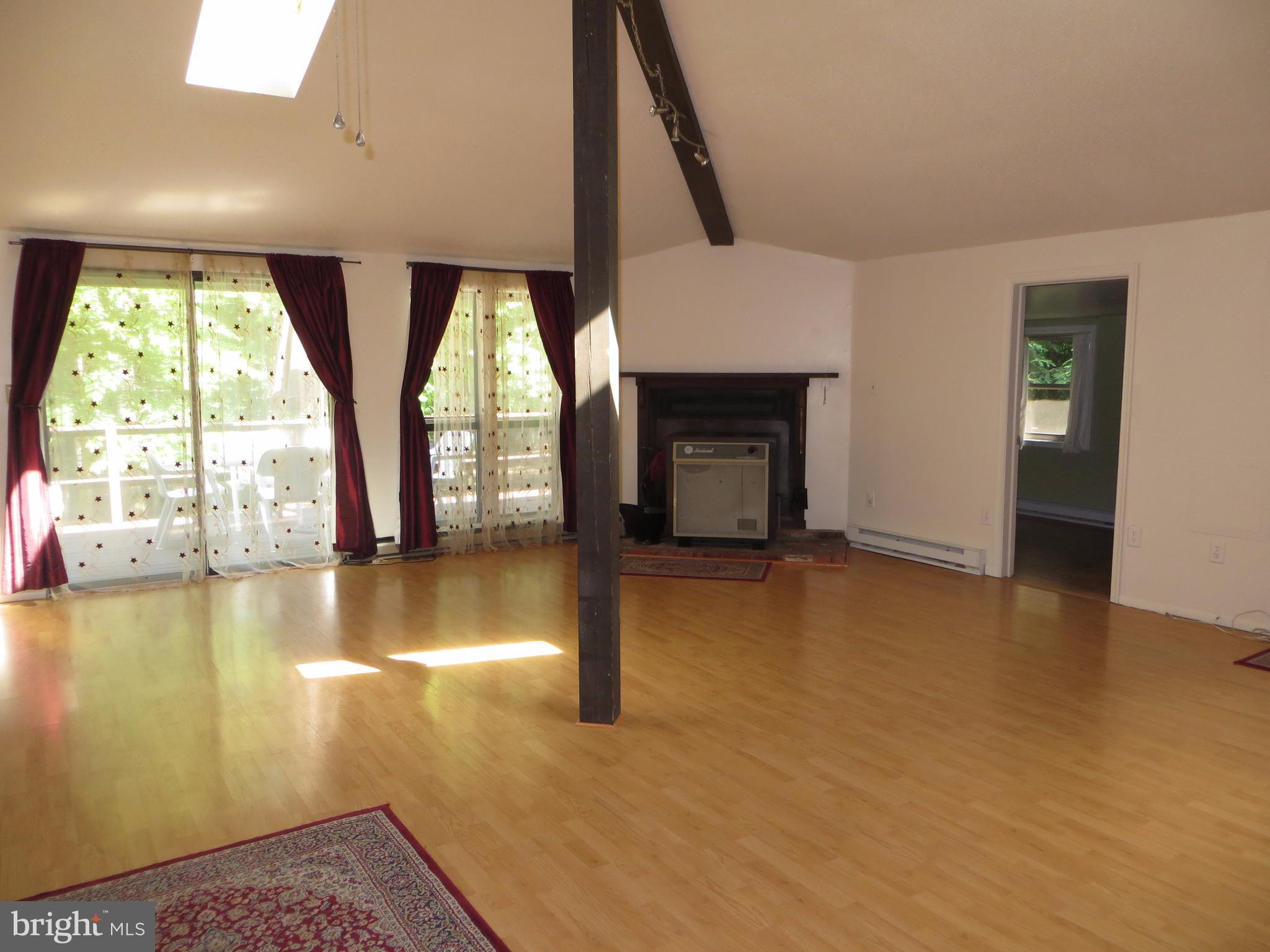 89 Ruffed Grouse Lane Hedgesville, WV 25427 - Photo 8 of 26 Great Room w/Double Slider to Large Deck