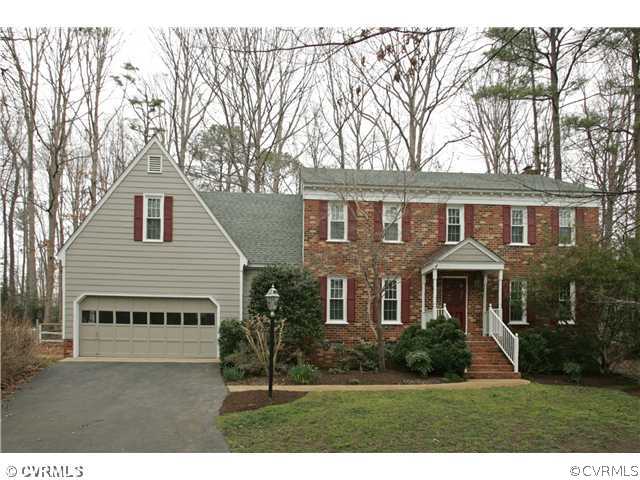 5703 Oak Knoll Road Midlothian, VA 23112 - Photo 1 of 12 a view of a yard in front of a house