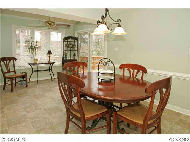 5703 Oak Knoll Road Midlothian, VA 23112 - Photo 3 of 12 a view of a dining room with furniture window and outside view