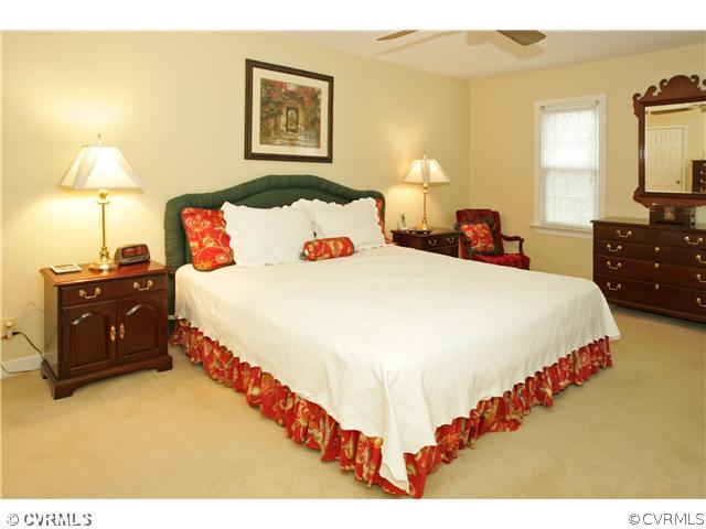 5703 Oak Knoll Road Midlothian, VA 23112 - Photo 7 of 12 a bedroom with bed and window