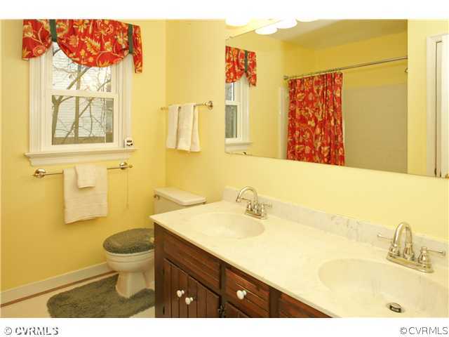 5703 Oak Knoll Road Midlothian, VA 23112 - Photo 8 of 12 a bathroom with a sink and a mirror