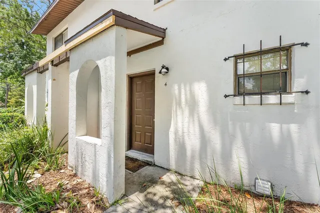 a front view of a house with a wooden fence