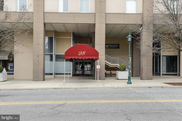 a view of an empty room with a potted plant