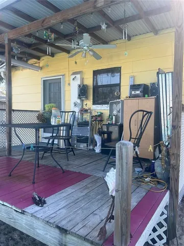 a living room with furniture a rug and a fireplace