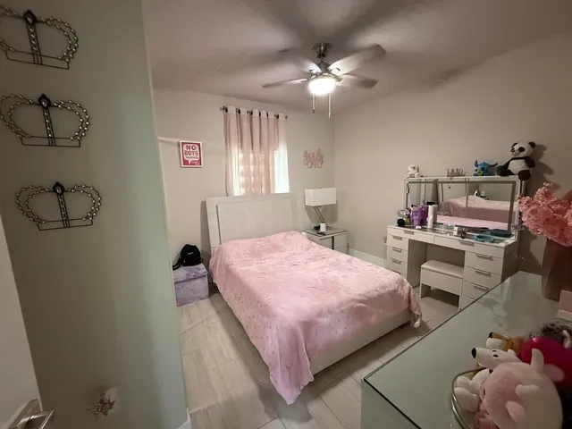 a bedroom with a bed and cabinets
