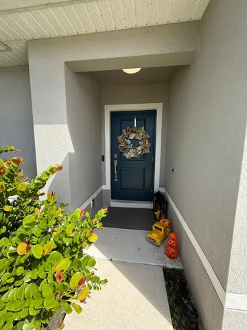 a vase of flowers sitting on a floor