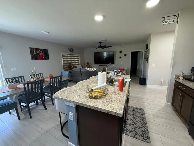 a living room with furniture and flat screen tv