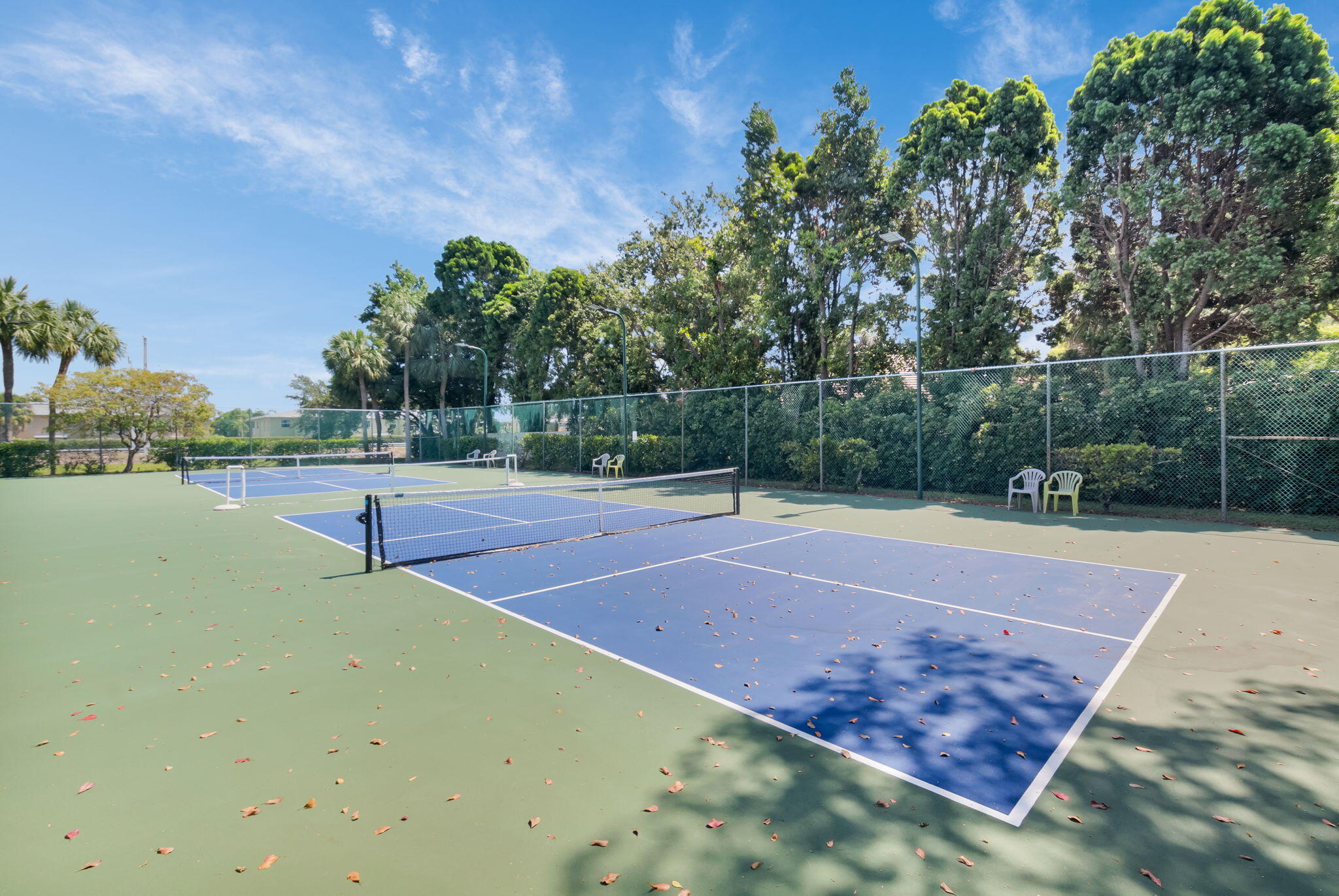 1850 Homewood Boulevard, Unit 214 Delray Beach, FL 33445 - Photo 27 of 38 a view of a tennis court