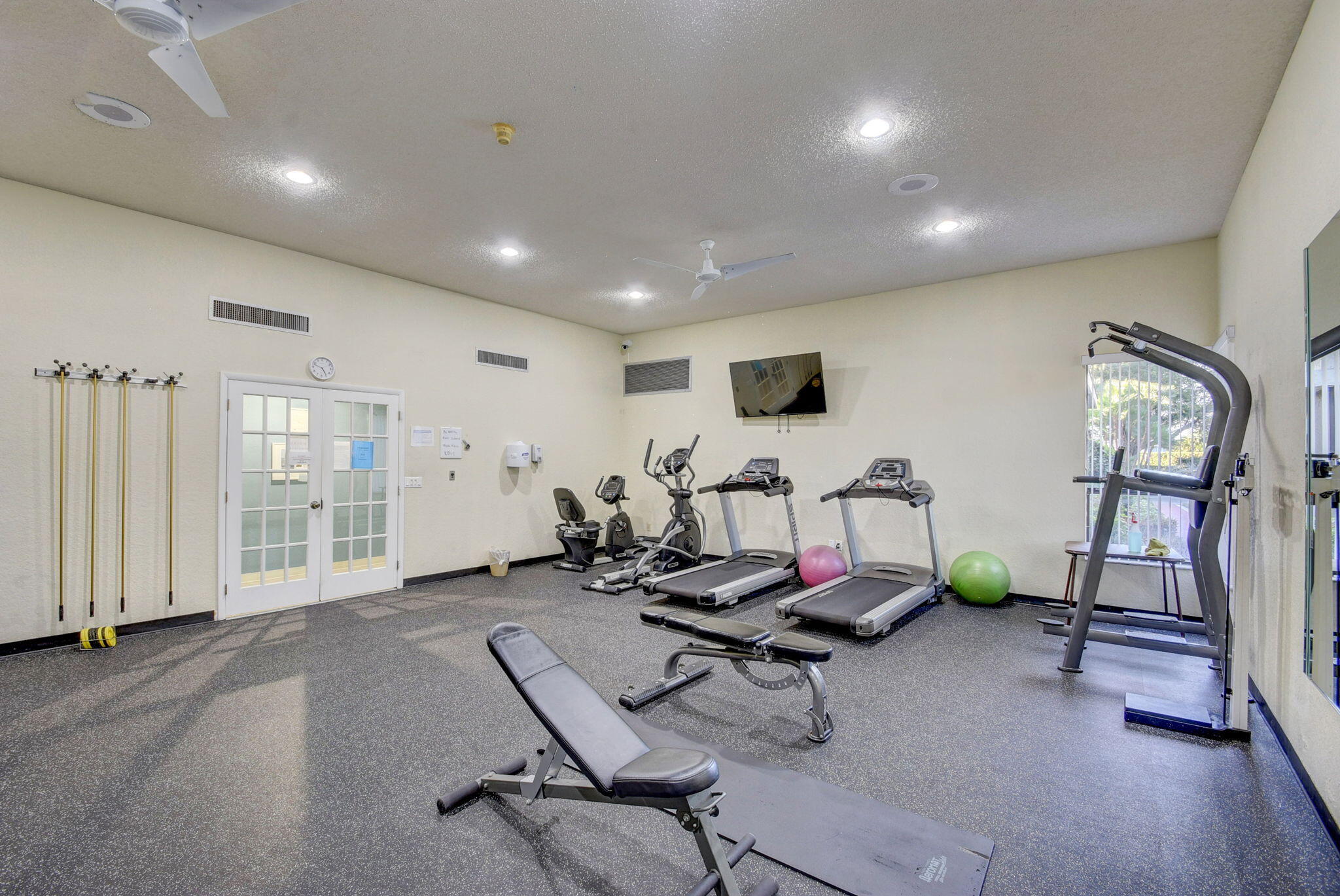 1850 Homewood Boulevard, Unit 214 Delray Beach, FL 33445 - Photo 31 of 38 a view of a room with gym equipment