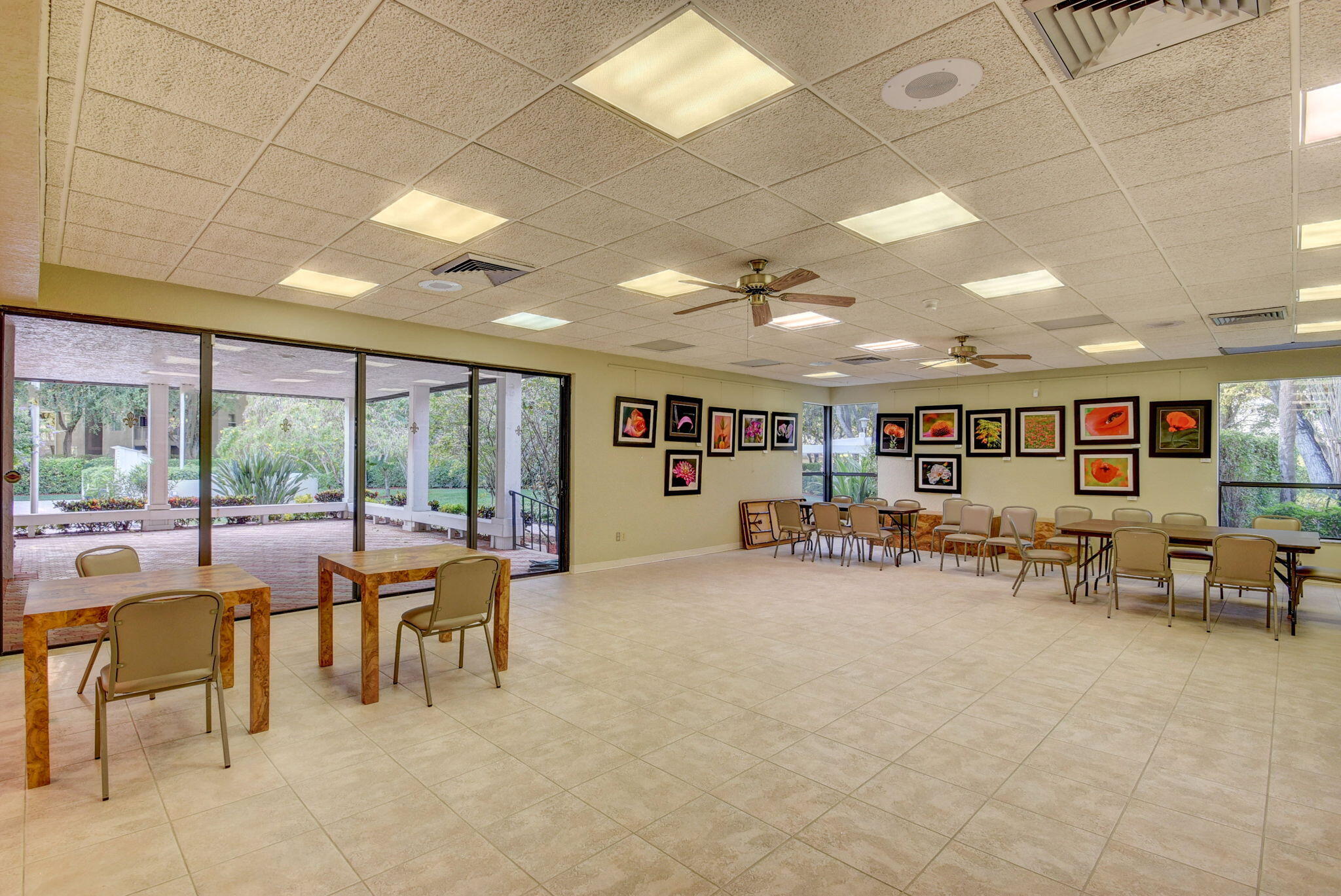 1850 Homewood Boulevard, Unit 214 Delray Beach, FL 33445 - Photo 34 of 38 a living room with furniture and a large window
