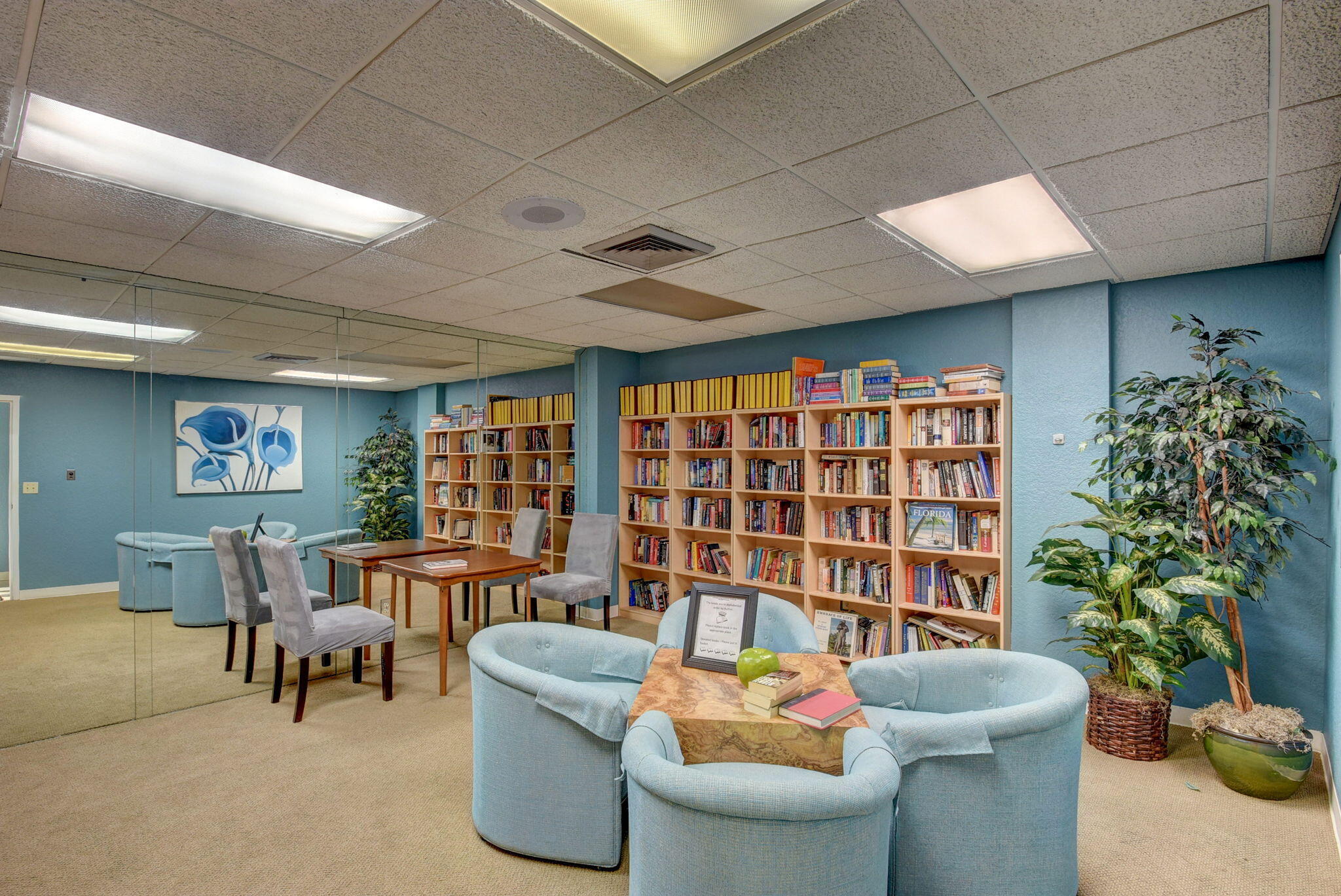 1850 Homewood Boulevard, Unit 214 Delray Beach, FL 33445 - Photo 36 of 38 a living room with furniture and a potted plant