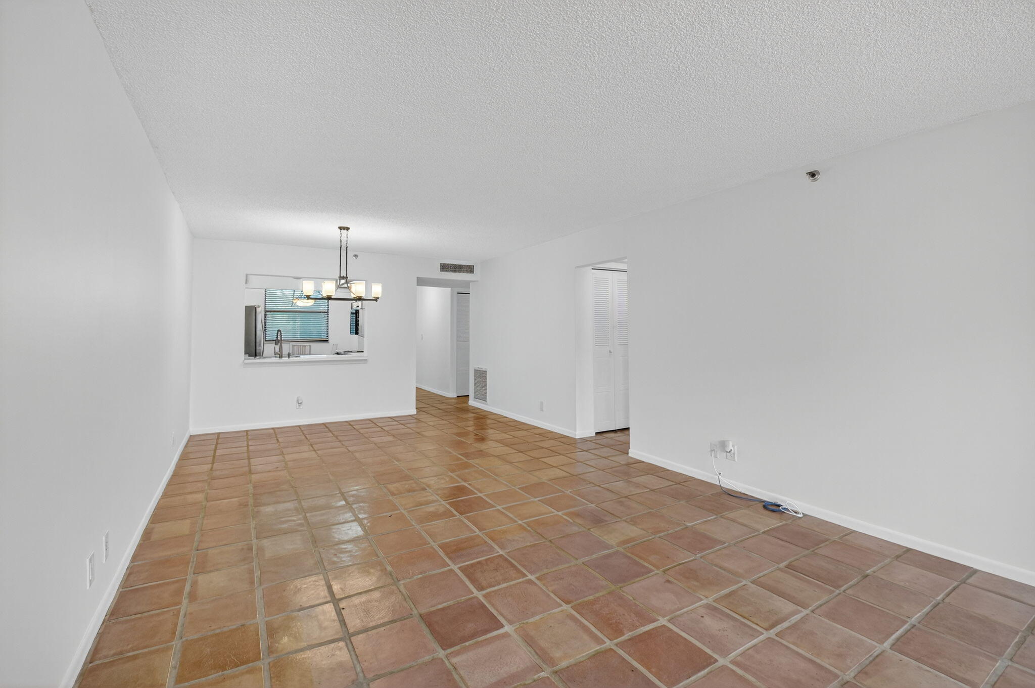 1850 Homewood Boulevard, Unit 214 Delray Beach, FL 33445 - Photo 5 of 38 a view of empty room with wooden floor