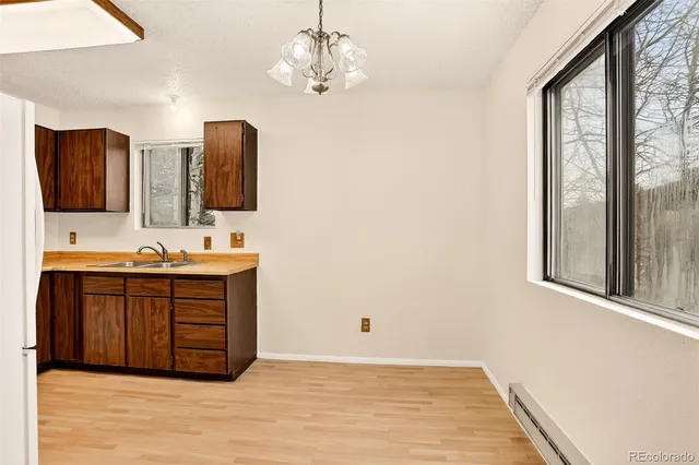 a bathroom with a double vanity sink a mirror and a bathtub