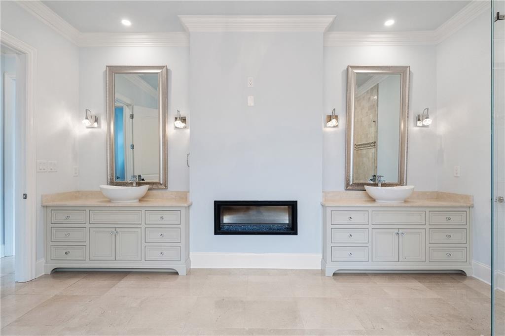14560 Wood Road Milton, GA 30004 - Photo 27 of 74 a spacious bathroom with a double vanity sink double mirror and bathtub