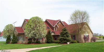 14360 Butternut Road Burton, OH 44021 - Photo 1 of 25 Stately and meticulous brick home on beautiful professionally landscaped 5-acre lot in Burton township with circular concrete drive overlooking small lake that is stocked with different fish for extra entertainment. Maintenance-free home. One owner, non-smoking, no animals.