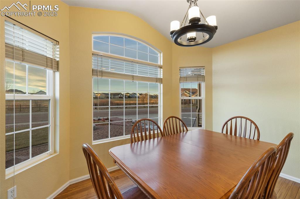 9015 Oakmont Road Peyton, CO 80831 - Photo 11 of 44 a view of a dining room with furniture and window