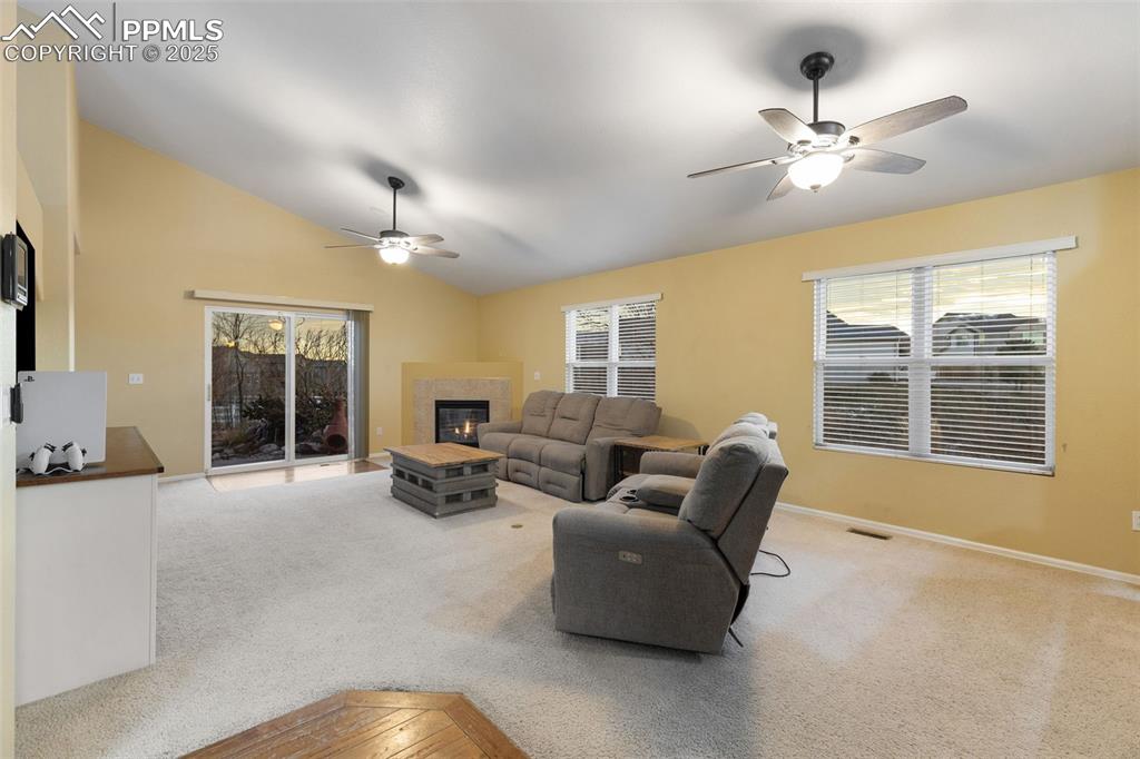 9015 Oakmont Road Peyton, CO 80831 - Photo 12 of 44 a living room with furniture and a chandelier