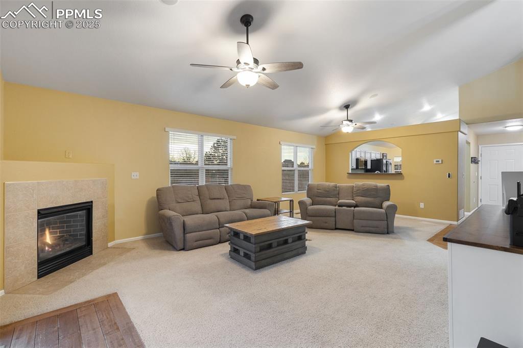9015 Oakmont Road Peyton, CO 80831 - Photo 13 of 44 a living room with furniture and fireplace