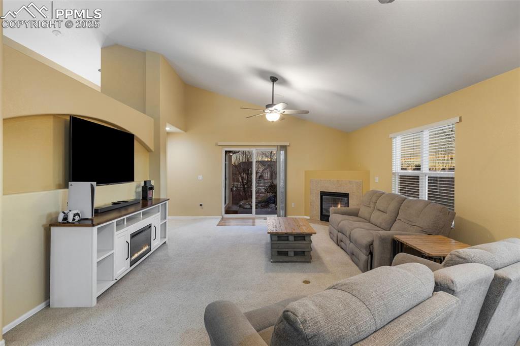9015 Oakmont Road Peyton, CO 80831 - Photo 14 of 44 a living room with furniture and a flat screen tv