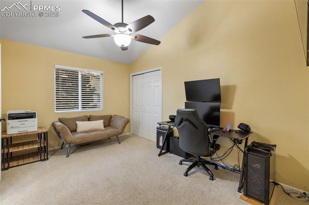 9015 Oakmont Road Peyton, CO 80831 - Photo 20 of 44 a view of a livingroom with workspace and a window