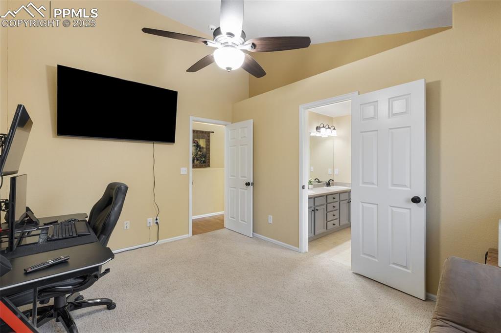 9015 Oakmont Road Peyton, CO 80831 - Photo 21 of 44 a view of a livingroom with furniture and a flat screen tv