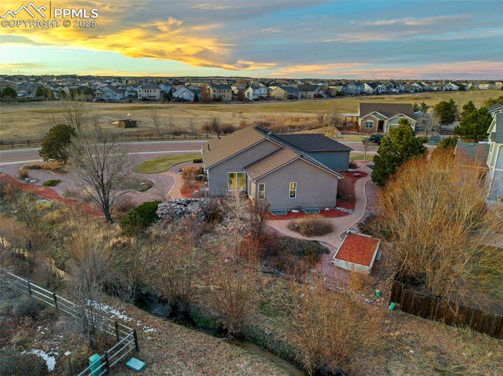 9015 Oakmont Road Peyton, CO 80831 - Photo 39 of 44 an aerial view of a house with a yard and lake view