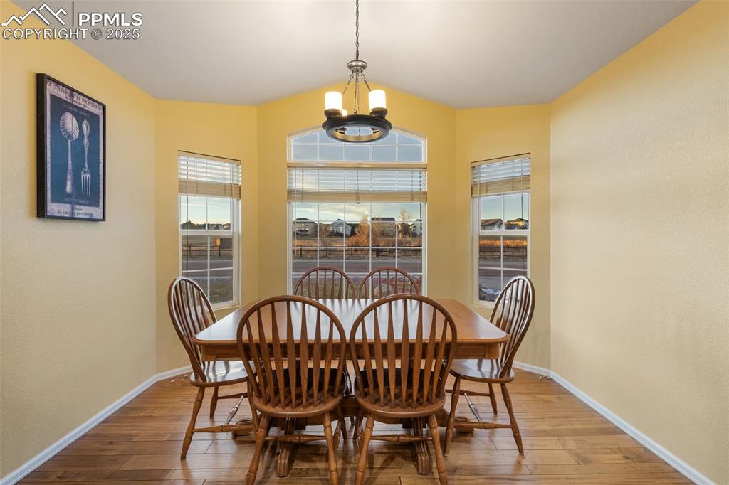 9015 Oakmont Road Peyton, CO 80831 - Photo 10 of 44 a view of a dining room with furniture window and outside view
