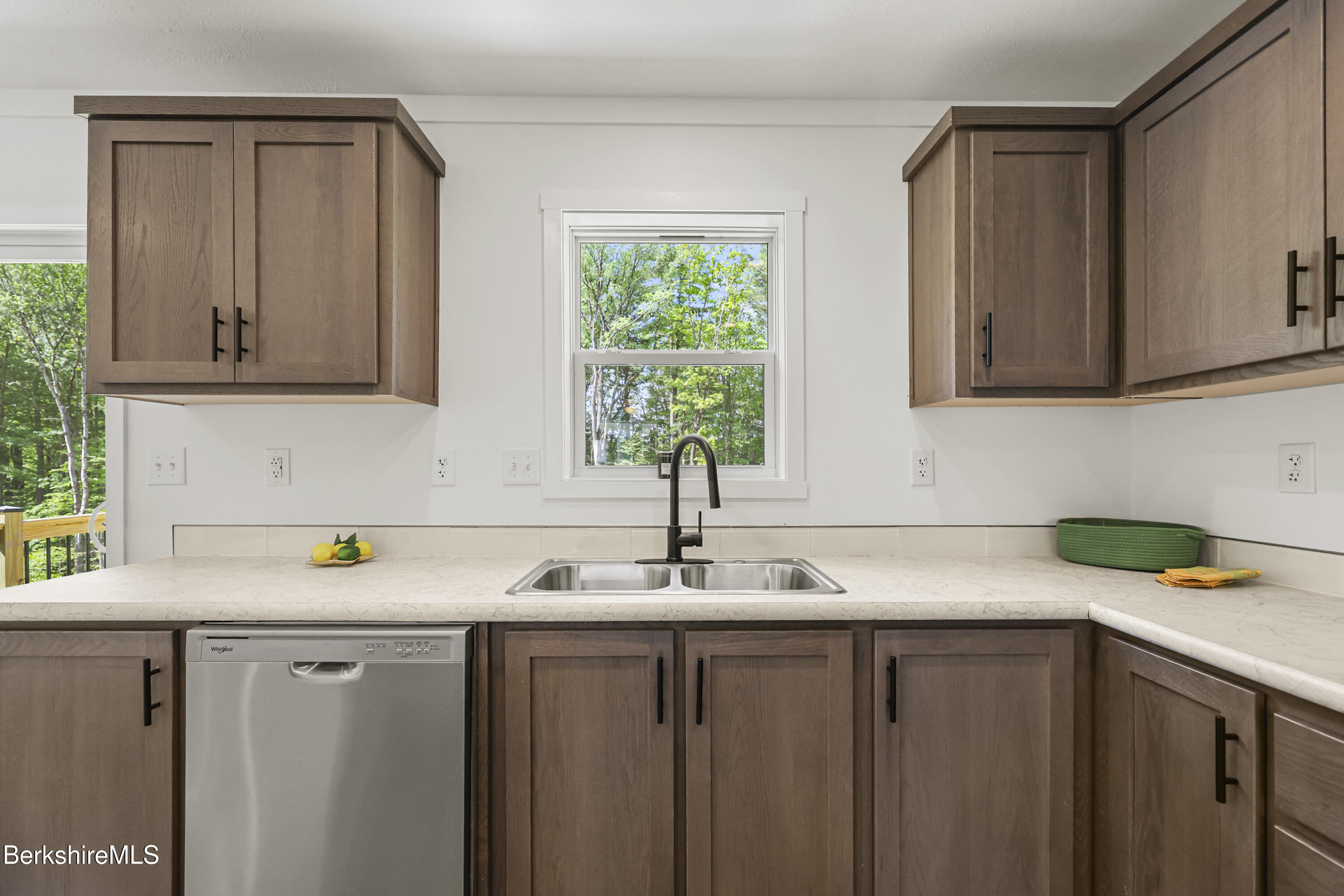 395 Cheshire Road, Unit 112 Pittsfield, MA 01201 - Photo 14 of 32 a kitchen with a sink cabinets and a window