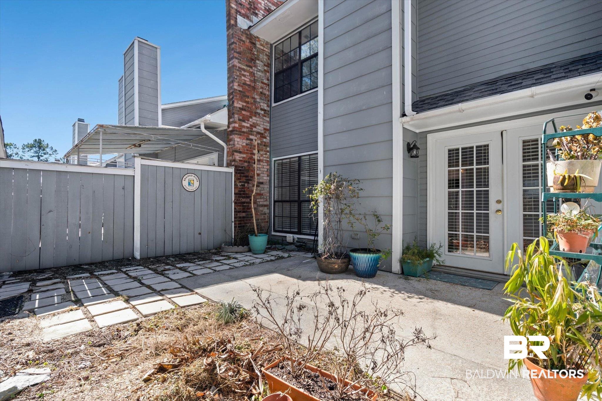 5900 Grelot Road, Unit 504 Mobile, AL 36609 - Photo 18 of 24 View of patio with french doors