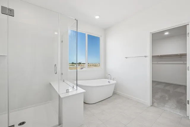 a bathroom with a white tub shower