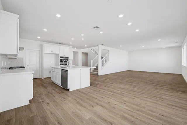 a view of kitchen with wooden floor