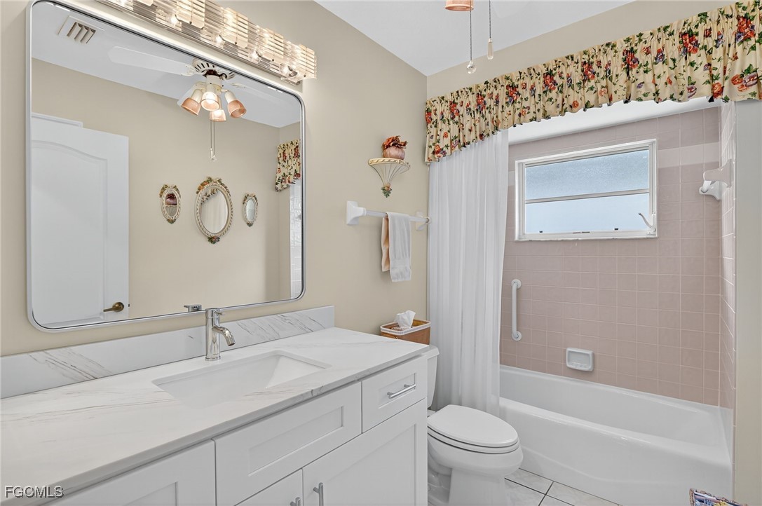 4306 Southwest 3rd Avenue Cape Coral, FL 33914 - Photo 18 of 50 a bathroom with a sink a toilet and shower