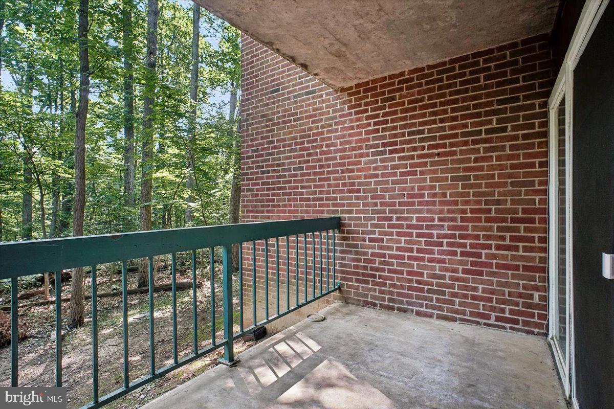 11805 Breton Court, Unit 1A Reston, VA 20191 - Photo 6 of 22 Large patio overlooking woods