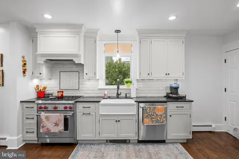 a kitchen with a table and chairs in it