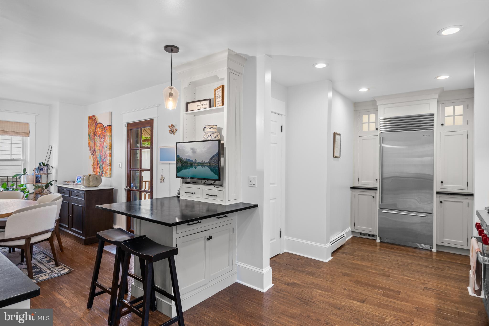 155 Rhoads Avenue Haddonfield, NJ 08033 - Photo 17 of 47 a kitchen with a table and chairs in it
