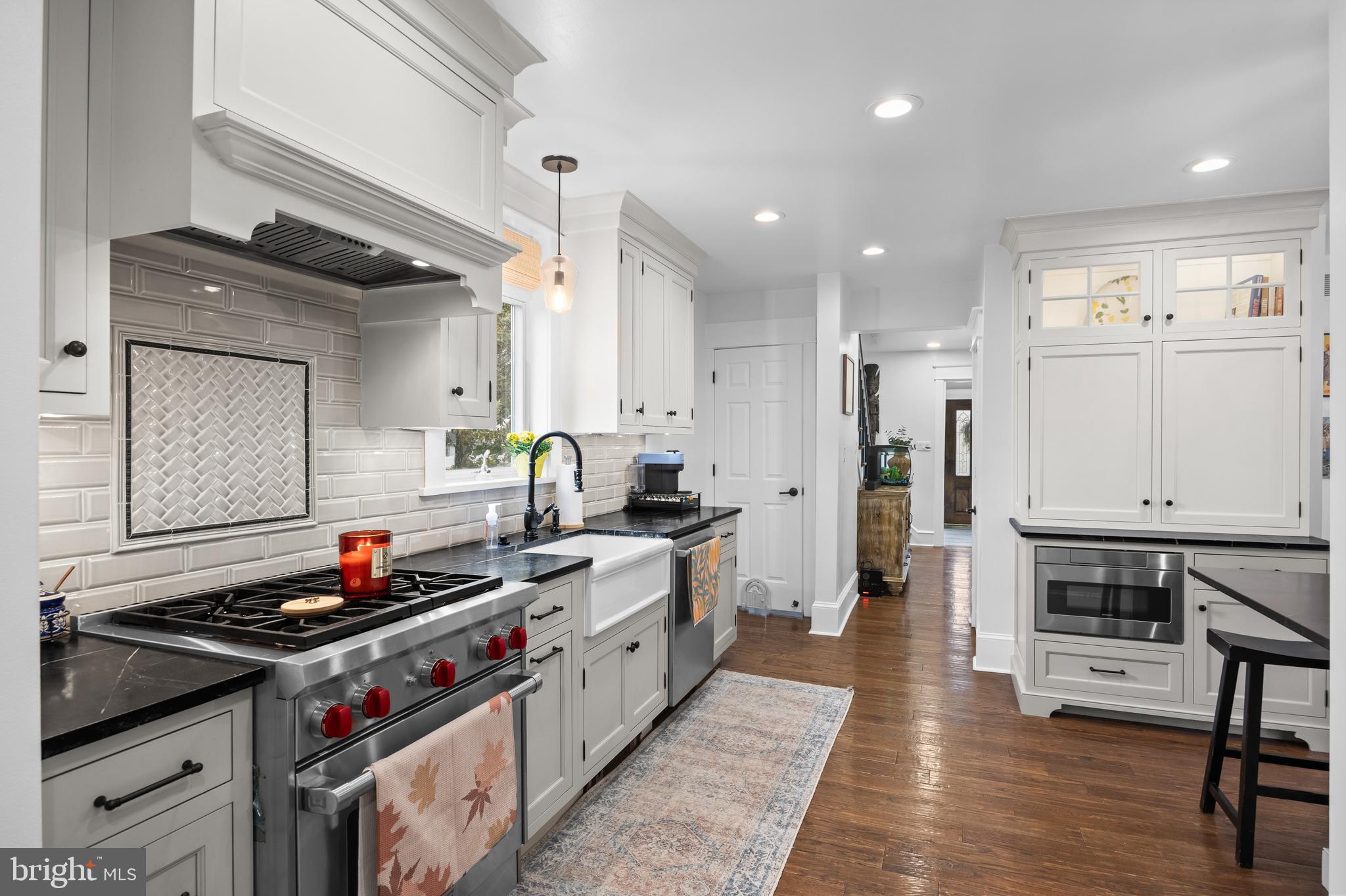 155 Rhoads Avenue Haddonfield, NJ 08033 - Photo 19 of 47 a kitchen with stainless steel appliances a stove a sink and a refrigerator