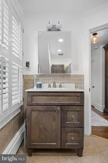 a view of staircase with white walls and a window