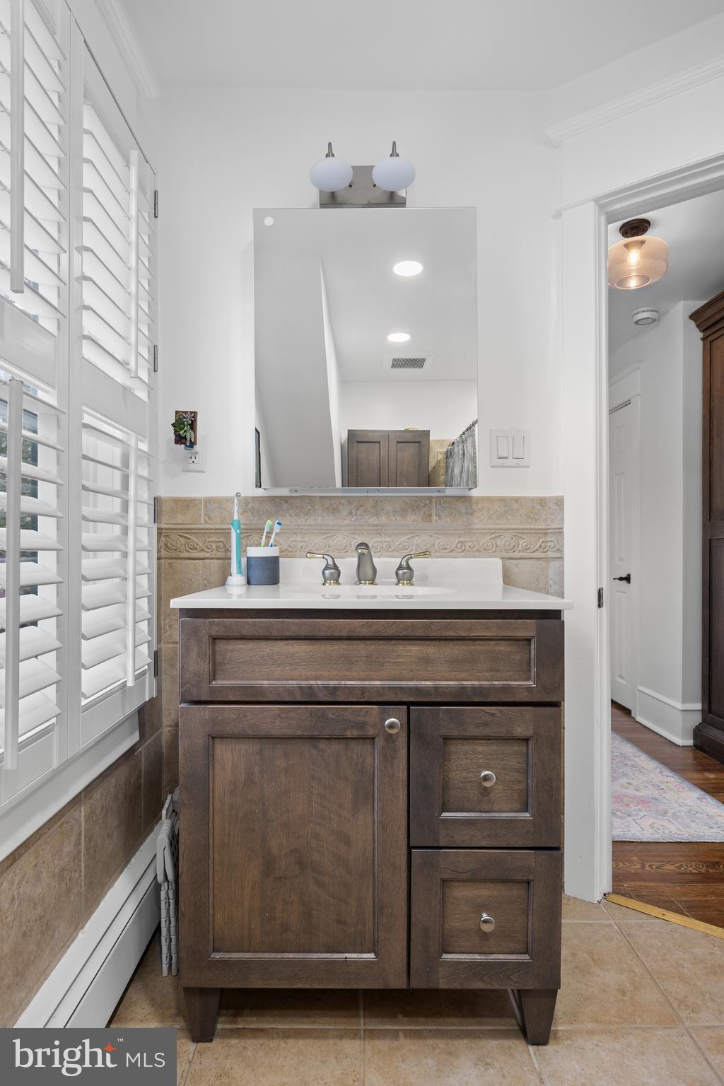 155 Rhoads Avenue Haddonfield, NJ 08033 - Photo 28 of 47 a bathroom with a sink and a mirror