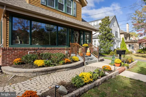 front view of a house with a swimming pool