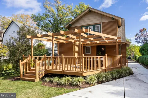 a view of a patio with a table and chairs