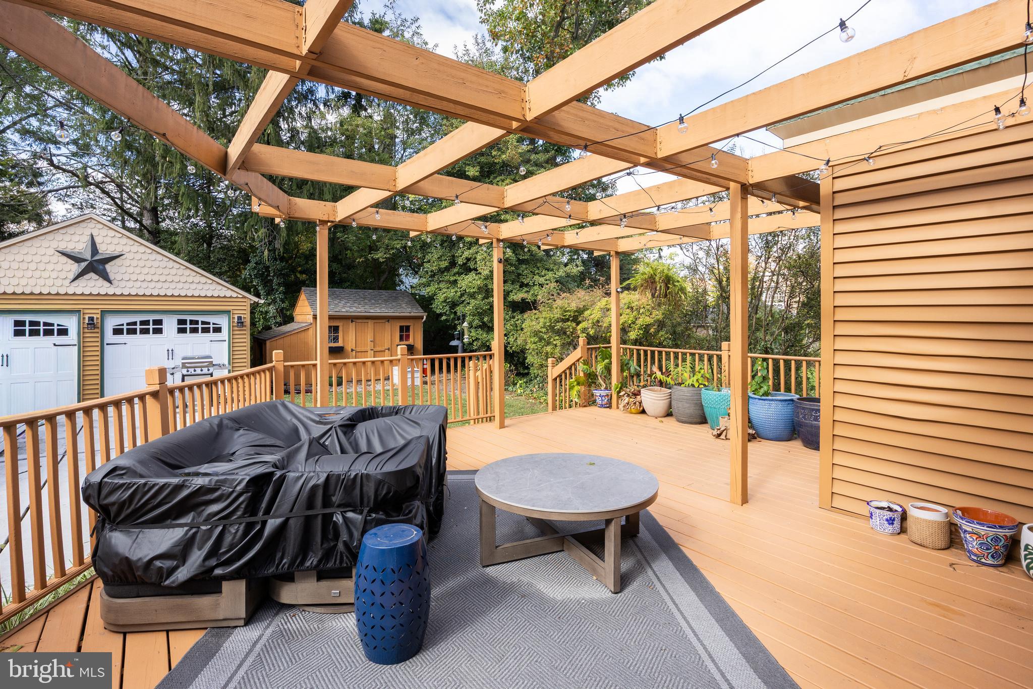 155 Rhoads Avenue Haddonfield, NJ 08033 - Photo 37 of 47 a view of a patio with a table and chairs