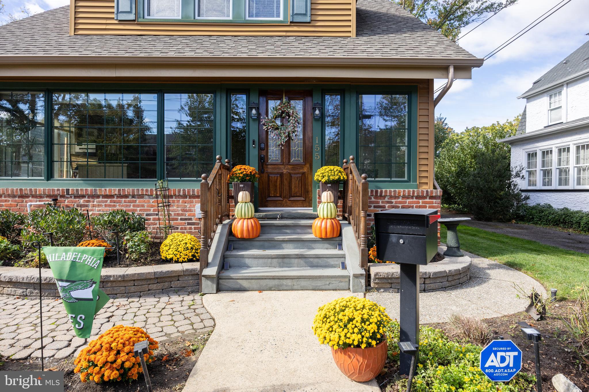155 Rhoads Avenue Haddonfield, NJ 08033 - Photo 4 of 47 a front view of a house with outdoor seating