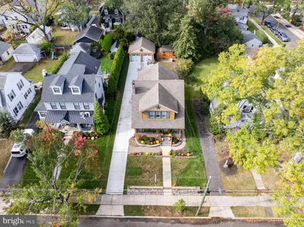 an aerial view of a house with outdoor space