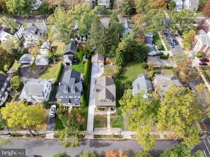 an aerial view of houses with yard