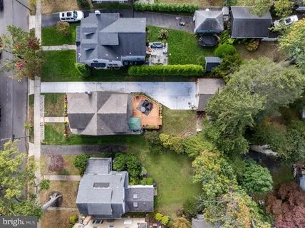 an aerial view of a house with a garden