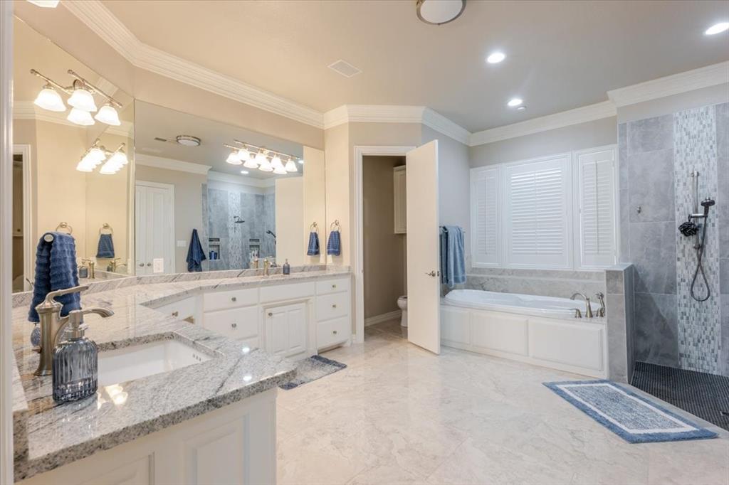166 East Rio Ridge Azle, TX 76020 - Photo 20 of 40 a bathroom with a granite countertop sink mirror bathtub and shower