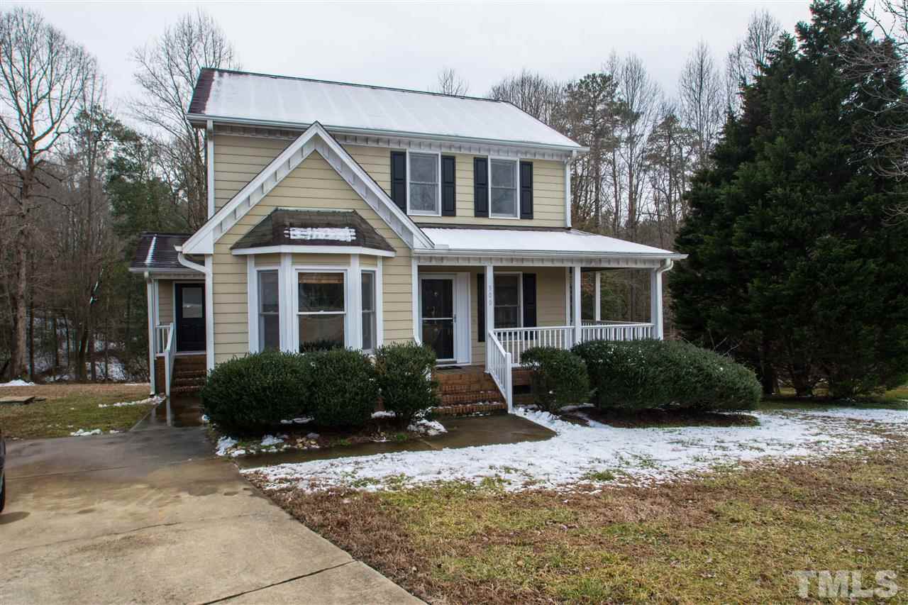 500 Jordan Ridge Lane Raleigh, NC 27603 - Photo 1 of 12 a front view of a house with a yard and potted plants