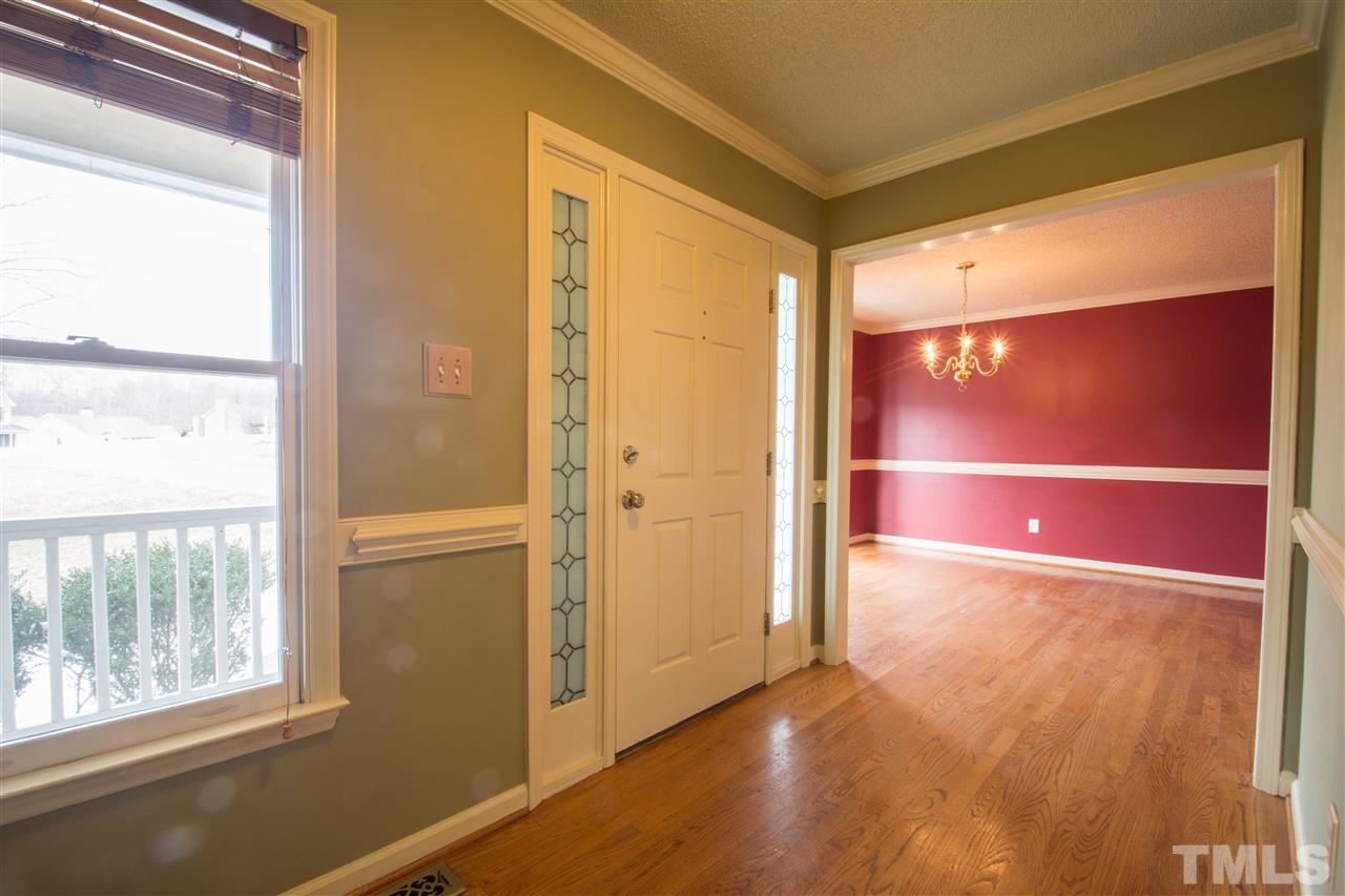 500 Jordan Ridge Lane Raleigh, NC 27603 - Photo 2 of 12 a view of empty room with wooden floor and windows