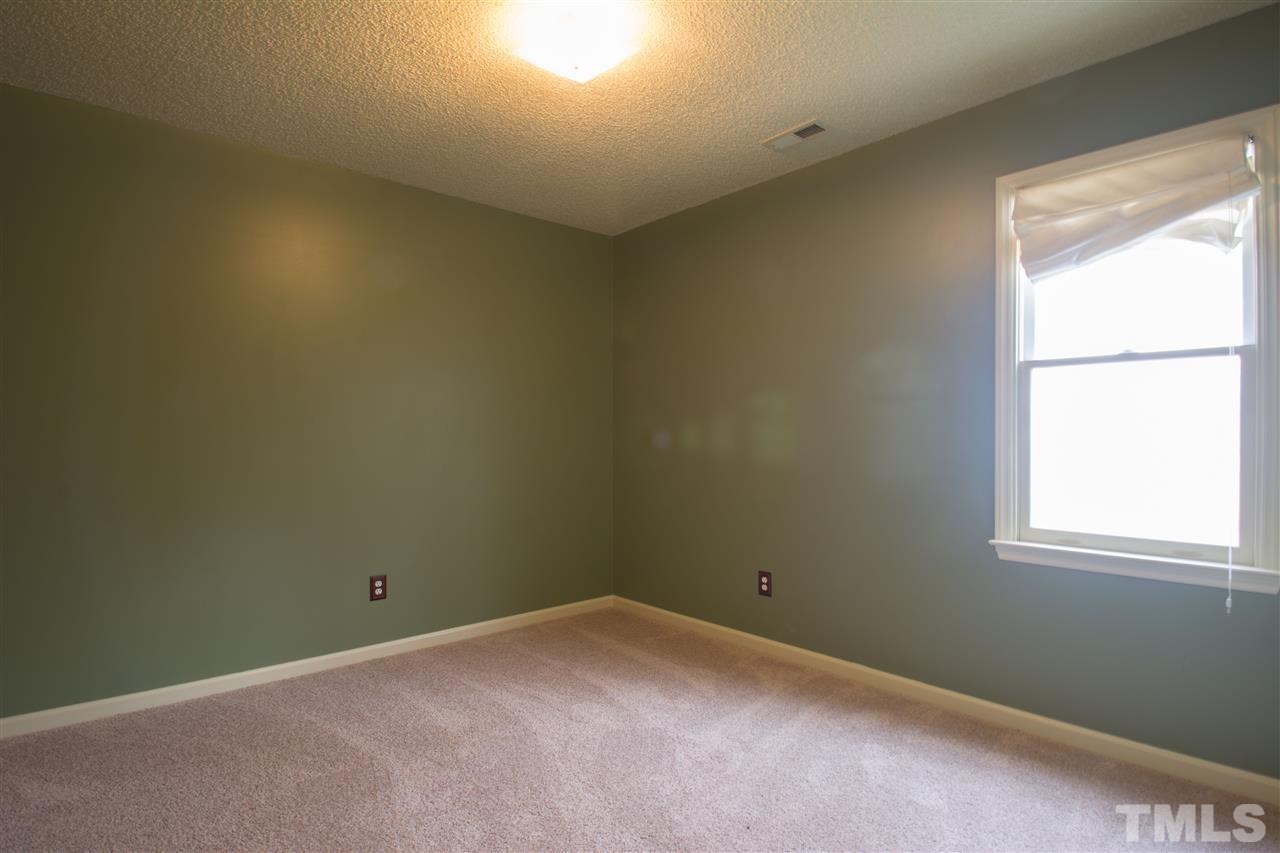 500 Jordan Ridge Lane Raleigh, NC 27603 - Photo 12 of 12 an empty room with a window