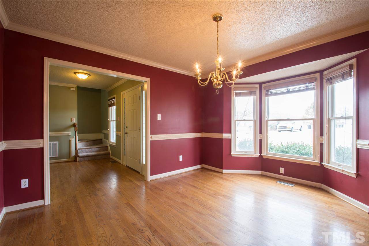 500 Jordan Ridge Lane Raleigh, NC 27603 - Photo 5 of 12 an empty room with window and outdoor view